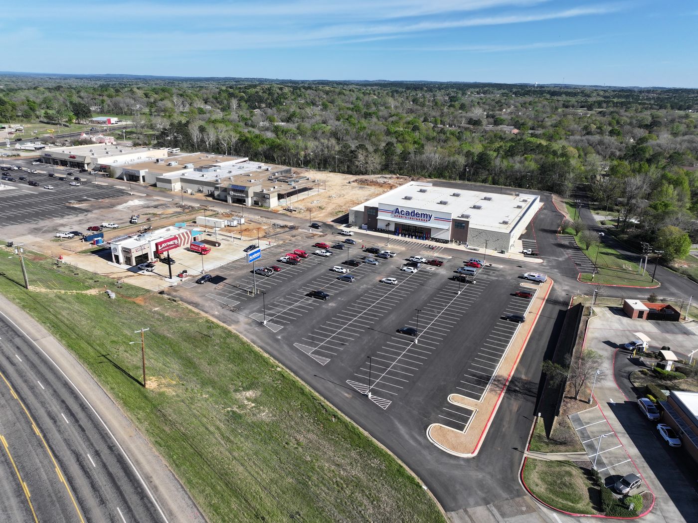 Aerial of a retail redevelopment with new big-box store and parking